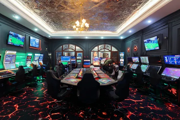 TPAD2 Casino — Step inside our high-end casino experience A glamorous woman holding casino chips in a neon-lit environment, representing the premium online casino atmosphere of TPAD2.
