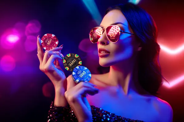 A player using their smartphone during a festive local event, representing TPAD2’s fully mobile-friendly casino.