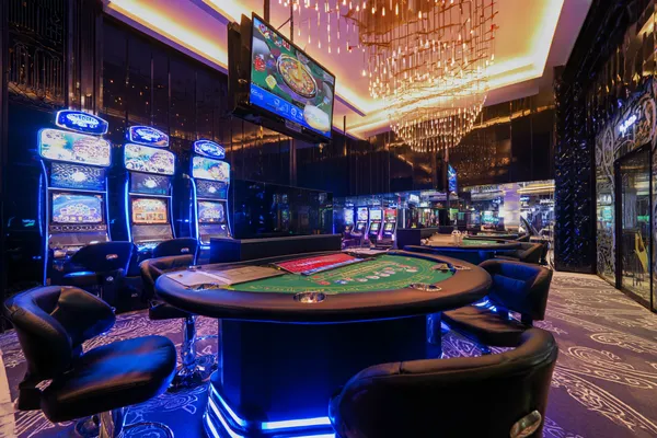 TPAD2 Login — Instantly access your secure account A confident dealer surrounded by casino chips inviting players to access their TPAD2 account, reflecting quick and easy login options.